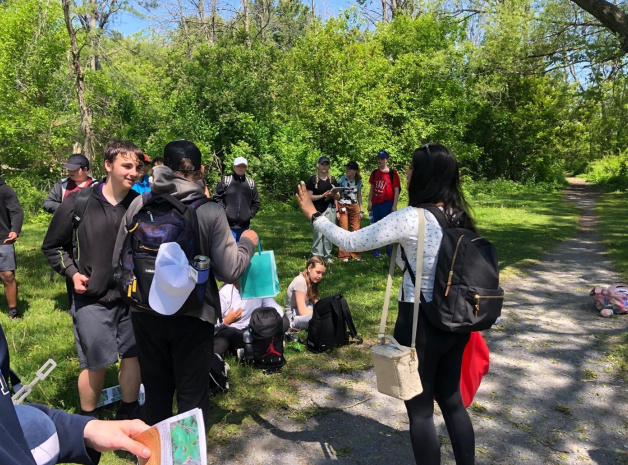 A group of young people starting a hike to Lake Ontario Park.